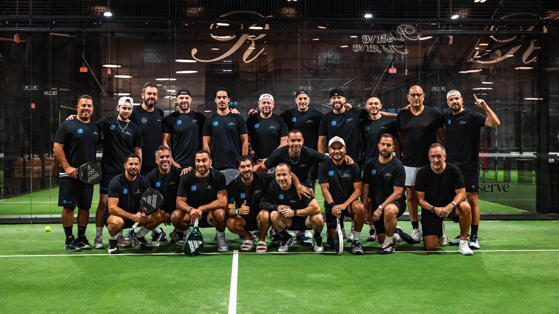 The Reserve Padel team in Genaya shirts, posing together on court